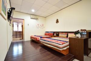 Postel nebo postele na pokoji v ubytování Xi Cun Homestay