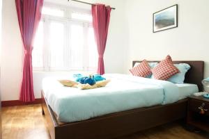 Katil atau katil-katil dalam bilik di Hope Guest House