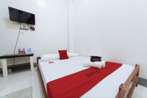 Voodi või voodid majutusasutuse RedDoorz @ Plaza Jaro Iloilo toas