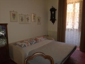Postel nebo postele na pokoji v ubytování Finestra Dell'Angelo