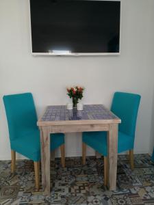 TV a/nebo společenská místnost v ubytování Appartements Apfelblüte