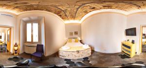 Ένα ή περισσότερα κρεβάτια σε δωμάτιο στο A casa di Ale e Lalla