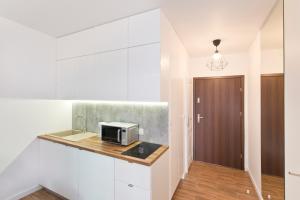 Kuchnia lub aneks kuchenny w obiekcie YOURAPART Chmielna Park