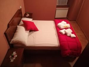 Postel nebo postele na pokoji v ubytování Le Case dell'Arco – Monte San Vito