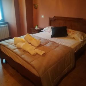 Postel nebo postele na pokoji v ubytování Le Case dell'Arco – Monte San Vito