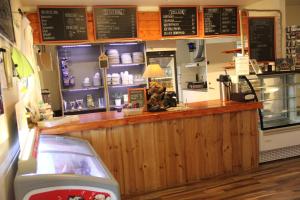 a coffee shop with a counter and a counter at Äventyrscampen in Sjöbo