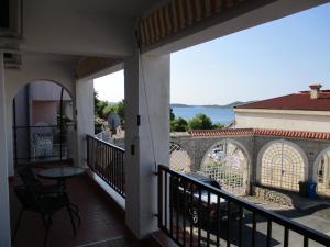 a balcony with a view of the ocean at Apartments Meni in Drage