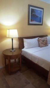 Ein Bett oder Betten in einem Zimmer der Unterkunft Tropical Home Oasis