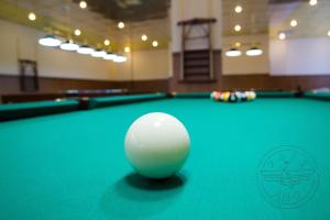 a pool ball on top of a pool table at Antwo-Hotel in Kharkiv +11 photos