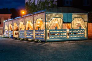 a train car with lights on it at night at Antwo-Hotel in Kharkiv