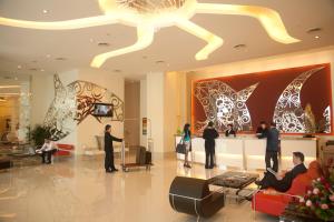 a group of people standing in a lobby at Hotel Sentral Pudu @ City Centre / Bukit Bintang in Kuala Lumpur