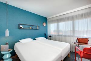 Postel nebo postele na pokoji v ubytování Hôtel ibis Styles Clermont-Ferrand Gare