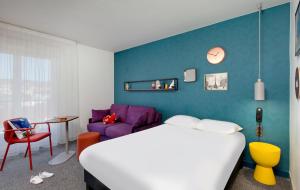 Postel nebo postele na pokoji v ubytování Hôtel ibis Styles Clermont-Ferrand Gare