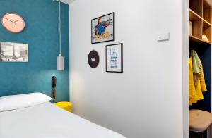 Postel nebo postele na pokoji v ubytování Hôtel ibis Styles Clermont-Ferrand Gare