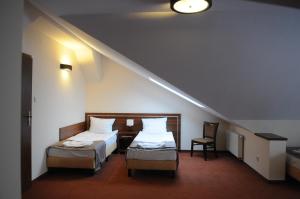 Postel nebo postele na pokoji v ubytování Hotel Martex