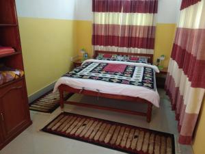 Katil atau katil-katil dalam bilik di Happy Sedi Lodge