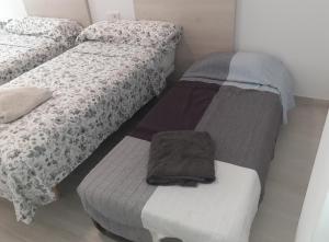 A bed or beds in a room at Luxury Beach Front Apartment with Pool