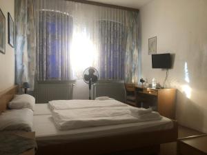 Postel nebo postele na pokoji v ubytování Krügers Hotel