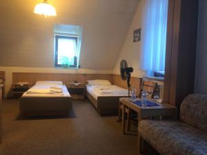 Postel nebo postele na pokoji v ubytování Krügers Hotel