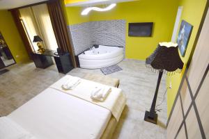 Voodi või voodid majutusasutuse Monte Mare Hotel toas