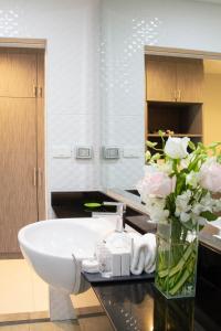 Ett badrum på FX Hotel Pattaya