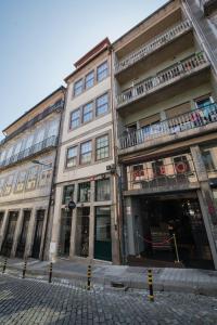 a group of buildings on a city street at Baixa24 •P1L• Amplo estúdio na baixa com varanda in Porto