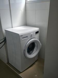 a washer and dryer in a small room at Apartment for relaxing and for health in Haifa