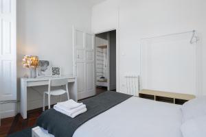 Postel nebo postele na pokoji v ubytování Baixa24 · City Center Private Sun Deck Apartment
