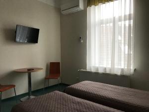 TV a/nebo společenská místnost v ubytování Hommiku Guesthouse