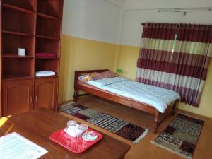 Katil atau katil-katil dalam bilik di Happy Sedi Lodge