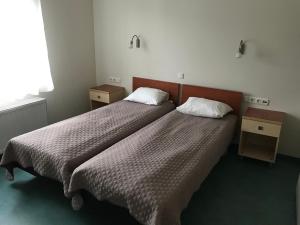 Postel nebo postele na pokoji v ubytování Hommiku Guesthouse