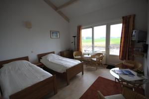 Postel nebo postele na pokoji v ubytování Boerderij "De Verwondering"