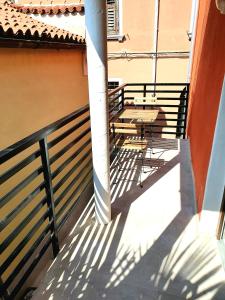 a balcony with a table and a fence at Casa Orange 2 in Koper