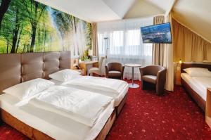 Ein Bett oder Betten in einem Zimmer der Unterkunft AHORN Panorama Hotel Oberhof