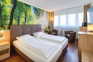 Ein Bett oder Betten in einem Zimmer der Unterkunft AHORN Panorama Hotel Oberhof