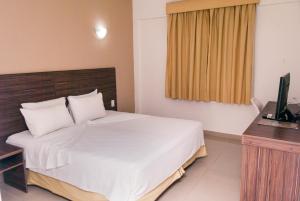 Cama ou camas em um quarto em Abba Hotel