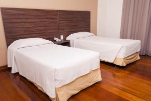 Cama ou camas em um quarto em Abba Hotel