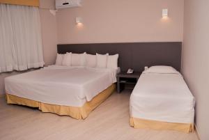 Cama ou camas em um quarto em Abba Hotel