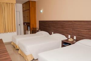 Cama ou camas em um quarto em Abba Hotel