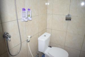 a bathroom with a shower with a toilet and a shower at Safsia homestay in Nusa Penida +47 photos