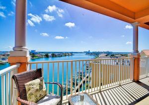 a balcony with a view of the water at Luxury 5 Star Condominium Water Front 3 Beds 2 Bath Pool Hot-Tub Beach And City Views in Clearwater Beach