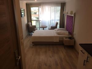 Postel nebo postele na pokoji v ubytování Cadde Suite Bakırköy