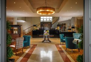 a lobby with chairs and a table in a building at The Park Hotel Dungarvan in Dungarvan