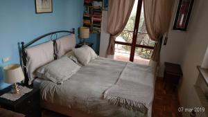 A bed or beds in a room at Residenza Montevile di Spaccini Gabriella