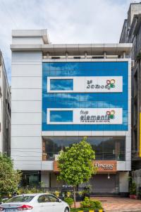 a building with a sign on the side of it at Five Elements in Visakhapatnam