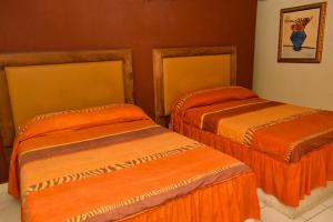 Postel nebo postele na pokoji v ubytování HOTEL BAEZA