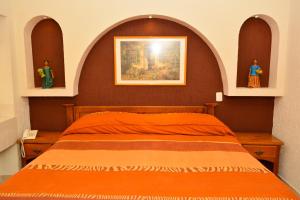 Postel nebo postele na pokoji v ubytování HOTEL BAEZA