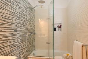 a bathroom with a shower and a bath tub at MyPlaceLisbon - Tágides River View in Lisbon +11 photos