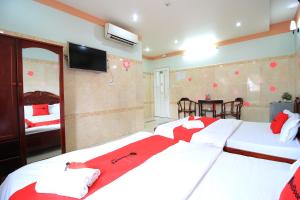 Postel nebo postele na pokoji v ubytování Chin Sao Hotel Nguyen Thi Thap