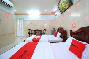 Postel nebo postele na pokoji v ubytování Chin Sao Hotel Nguyen Thi Thap